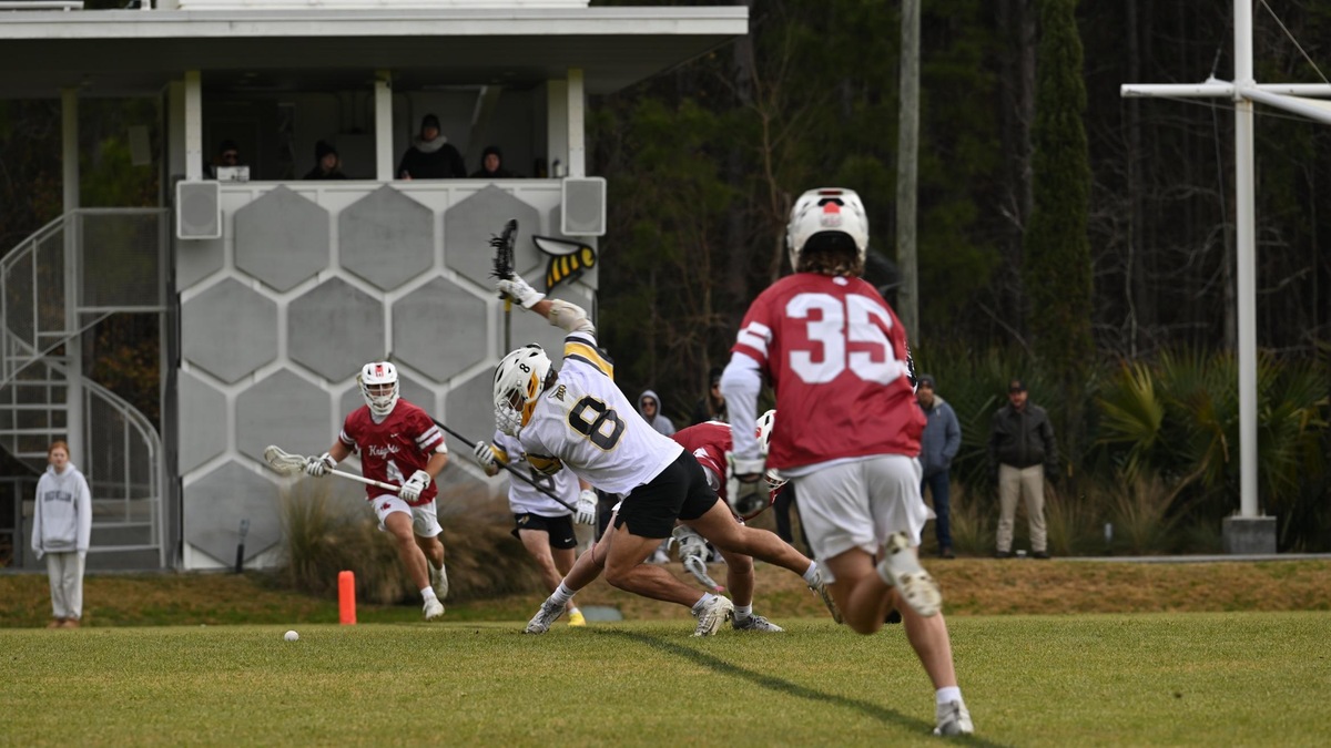 Lucas Martinez of SCAD Savannah (Ga.) (#8) wins the faceoff