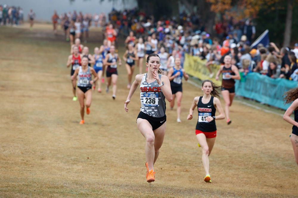 cross country runners running on an outdoor trail