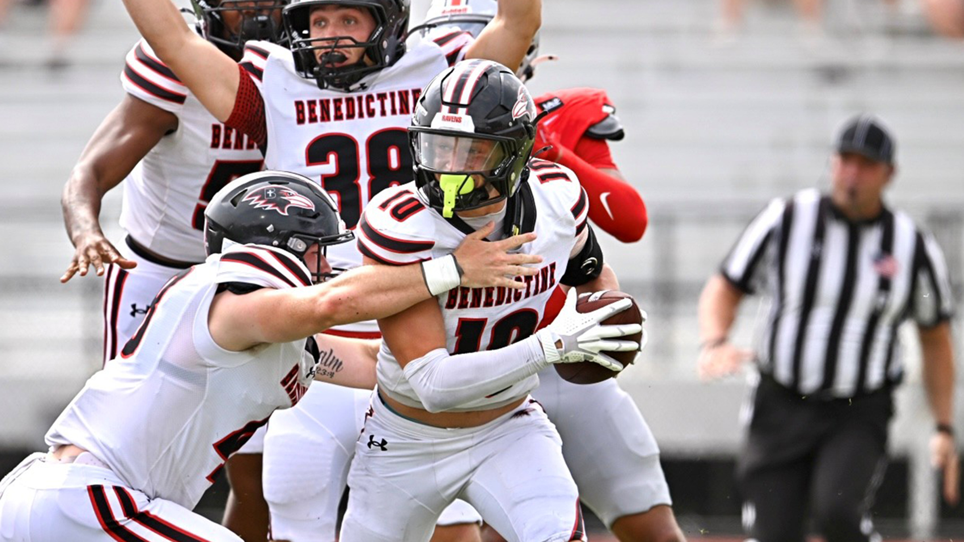 Anthony Lonergan celebrates a punt recovery in the end zone that put Benedictine in front of Grand View late in Saturday's game.