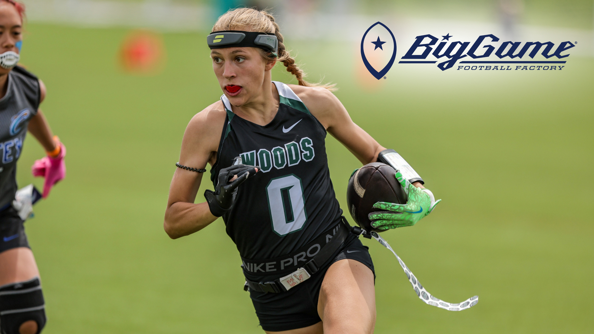 women's flag football player running with football