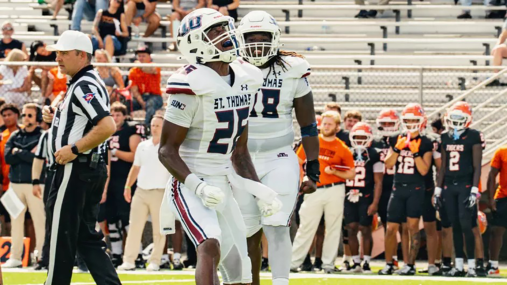 St. Thomas players celebrate a touchdown.